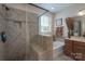 Well-lit bathroom featuring a tiled shower with a glass enclosure and a separate bathtub at 866 Tyne Dr, Fort Mill, SC 29715
