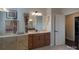 Modern bathroom featuring a wooden vanity with a white countertop and a large mirror at 866 Tyne Dr, Fort Mill, SC 29715