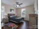 Cozy bedroom with dark wood floors, neutral walls, and a ceiling fan for added comfort at 866 Tyne Dr, Fort Mill, SC 29715