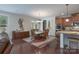 Open dining area with a large window, chandelier, and hardwood floors is ideal for gatherings at 866 Tyne Dr, Fort Mill, SC 29715