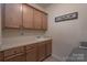 Functional laundry room with ample cabinet space and a sink for added convenience at 866 Tyne Dr, Fort Mill, SC 29715