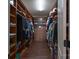 Spacious walk-in closet with custom wood shelving and ample storage for clothes and accessories at 866 Tyne Dr, Fort Mill, SC 29715
