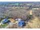 Aerial view of a large estate property with a lake, golf course, and luxurious neighborhood at 8716 Ruby Hill Ct, Waxhaw, NC 28173