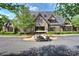 Charming clubhouse with stone facade and well-kept landscaping, complete with a golf cart at 8716 Ruby Hill Ct, Waxhaw, NC 28173