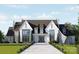 Majestic new home with a beautifully landscaped lawn and grand entrance at 8716 Ruby Hill Ct, Waxhaw, NC 28173