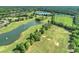 Expansive aerial view of the lush golf course with mature trees and water features, perfect for golfers at 8716 Ruby Hill Ct, Waxhaw, NC 28173