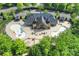 Aerial view of the community pool with ample seating and lounge areas, surrounded by trees at 8716 Ruby Hill Ct, Waxhaw, NC 28173