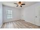 Bedroom with a window, closet, and wood flooring at 8919 Oransay Way, Charlotte, NC 28278
