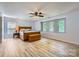 Primary bedroom with three windows and a ceiling fan at 8919 Oransay Way, Charlotte, NC 28278