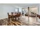 Open dining room and living room layout with wood flooring at 8919 Oransay Way, Charlotte, NC 28278