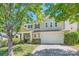 Charming two-story home with a two-car garage, lush landscaping, and a welcoming front porch at 8919 Oransay Way, Charlotte, NC 28278