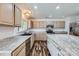 Modern kitchen with stainless steel appliances, stylish countertops, a black sink and wood-look flooring at 8919 Oransay Way, Charlotte, NC 28278