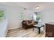 Comfortable living room with a cozy couch, a glass-topped coffee table, and plenty of natural light at 8919 Oransay Way, Charlotte, NC 28278