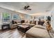 Spacious living room with a large sectional sofa and lots of natural light at 8919 Oransay Way, Charlotte, NC 28278