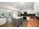 Well-lit kitchen features a butcher block countertops, stainless steel appliances and center island with seating at 8936 Rittenhouse Cir, Charlotte, NC 28270