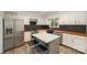 Bright kitchen displays an island with bar stool seating, wood countertops, and stainless steel appliances at 8936 Rittenhouse Cir, Charlotte, NC 28270