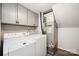 Functional laundry room features washer, dryer, storage cabinets, and utility systems at 8936 Rittenhouse Cir, Charlotte, NC 28270