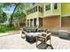 Cozy backyard featuring brick patio, seating and screened porch providing a relaxed outdoor space at 9809 Hanover Hollow Dr, Charlotte, NC 28210