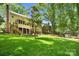 Spacious backyard features a patio and playground offering ample space for outdoor activities at 9809 Hanover Hollow Dr, Charlotte, NC 28210