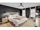Main bedroom with neutral carpet, shuttered windows, modern ceiling fan, and ample natural light at 9809 Hanover Hollow Dr, Charlotte, NC 28210