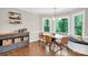 Cozy dining area with a banquette seating, natural light, and stylish decor at 9809 Hanover Hollow Dr, Charlotte, NC 28210