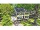 Beautiful two-story home with a well-manicured lawn, attached garage, and mature trees at 9809 Hanover Hollow Dr, Charlotte, NC 28210