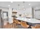 Beautiful kitchen featuring white cabinets, stainless steel appliances, and a large center island at 9809 Hanover Hollow Dr, Charlotte, NC 28210