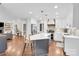 Bright, modern kitchen with a large island, stainless steel appliances, and pendant lighting at 9809 Hanover Hollow Dr, Charlotte, NC 28210