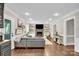 Cozy living room with a stone fireplace, built-in shelving, and comfortable seating at 9809 Hanover Hollow Dr, Charlotte, NC 28210