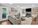 Comfortable living room with a fireplace, stylish decor, and natural light at 9809 Hanover Hollow Dr, Charlotte, NC 28210