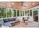 Relaxing sunroom with comfortable seating, wood ceiling, and screened windows with backyard views at 9809 Hanover Hollow Dr, Charlotte, NC 28210