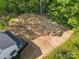 Aerial view of the home, highlighting a large yard and lush greenery at 1 Linestowe Dr, Belmont, NC 28012