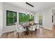 Bright dining room with a modern chandelier and large windows at 1 Linestowe Dr, Belmont, NC 28012