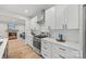 Contemporary kitchen featuring white cabinets, quartz countertops, and stainless steel appliances at 1 Linestowe Dr, Belmont, NC 28012