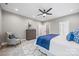 Bright bedroom featuring a ceiling fan, dresser, neutral walls, and a geometric rug design at 1 Linestowe Dr, Belmont, NC 28012