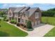 Beautiful brick home with three-car garage, lush landscaping, and a well-manicured lawn at 101 Stonehurst Ln, Waxhaw, NC 28173