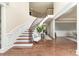 Elegant foyer with curved staircase, hardwood floors, and stylish decor at 101 Stonehurst Ln, Waxhaw, NC 28173