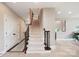 Foyer with carpeted stairs, hardwood flooring, and natural light, providing a warm greeting at 101 Stonehurst Ln, Waxhaw, NC 28173