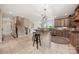 Open-concept kitchen and living area with a large island and barstool seating, ideal for gatherings at 101 Stonehurst Ln, Waxhaw, NC 28173