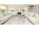 Cozy living room with fireplace, neutral decor, and comfortable seating at 101 Stonehurst Ln, Waxhaw, NC 28173