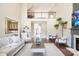 Open-concept living room with fireplace, hardwood floors, and a view of the upper level at 101 Stonehurst Ln, Waxhaw, NC 28173