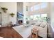 Bright living room featuring soaring ceilings, fireplace, large windows and hardwood flooring at 101 Stonehurst Ln, Waxhaw, NC 28173