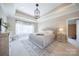 A spacious main bedroom features a trey ceiling, neutral colors, and ample natural light at 101 Stonehurst Ln, Waxhaw, NC 28173
