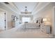 A beautiful main bedroom features a tray ceiling, neutral colors, and an en-suite bathroom at 101 Stonehurst Ln, Waxhaw, NC 28173