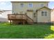 Home's backyard features a deck, a lush lawn, and mature trees at 10116 Garman Hill Dr, Charlotte, NC 28214