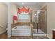 Full bathroom with a tub and separate glass-enclosed shower, perfect for a relaxing and functional space at 10116 Garman Hill Dr, Charlotte, NC 28214