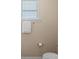 Bathroom with neutral walls, toilet, towel rack and blinds at 10116 Garman Hill Dr, Charlotte, NC 28214