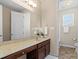 Bathroom with neutral walls, vanity, large mirror, and tile floor at 10116 Garman Hill Dr, Charlotte, NC 28214