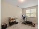 Versatile room featuring neutral walls, with a treadmill and workspace at 10116 Garman Hill Dr, Charlotte, NC 28214