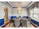 Dining area featuring elegant chandelier, large window, and access to kitchen with modern stainless steel appliances at 10116 Garman Hill Dr, Charlotte, NC 28214
